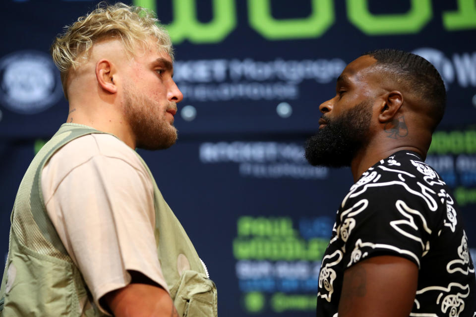 LOS ANGELES, CALIFORNIA - JULY 13: Jake Paul (L) and Tyron Woodley (R) face off during a press conference before their cruiserweight fight at The Novo by Microsoft at L.A. Live on July 13, 2021 in Los Angeles, California. (Photo by Katelyn Mulcahy/Getty Images)