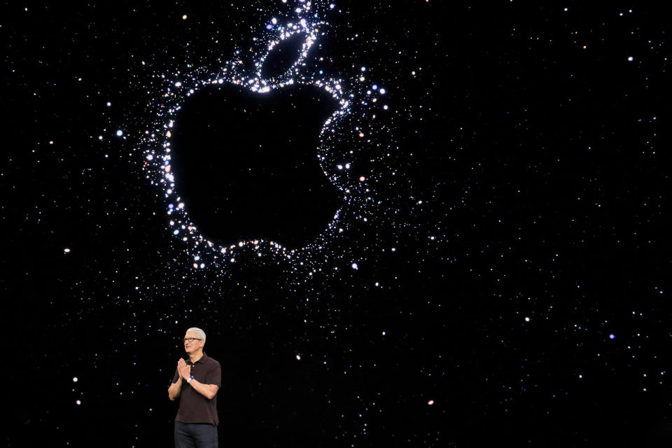 Apple CEO Tim Cook presents the new iPhone 14 at an Apple event at their headquarters in Cupertino, California, U.S. September 7, 2022. REUTERS/Carlos Barria