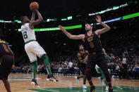 Boston Celtics guard Kemba Walker (8) shoots over Cleveland Cavaliers forward Kevin Love (0) during the second half of an NBA basketball game in Boston, Monday, Dec. 9, 2019. The Celtics won 110-88. (AP Photo/Charles Krupa)