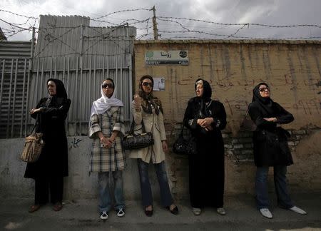 Iranian women wait in line outside a polling station during the Iranian presidential election in Tehran, in this June 12, 2009 file photo. REUTERS/Ahmed Jadallah/Files