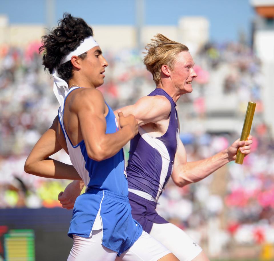 Cross Plains' Ryan Reed (right) runs next to Turkey Valley's Adrian Valdes at the state track and field meet in Austin on Saturday, May 14, 2022.