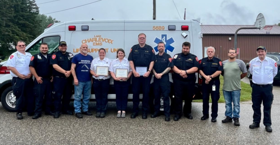 Award recipients stand in front of a new fuel efficient Lake Charlevoix EMS Authority ambulance (from left to right): Lyon Stephens, Erik Hosler, Mike Pionk, Tom Tuck, Brenda Willson (Boyne City), Wendi Noeske (Boyne City), Manual “Joe” Travers, Jason Coffey, Casey Riley, Tom Birgy, Craig Johnson and Jesse Silva.