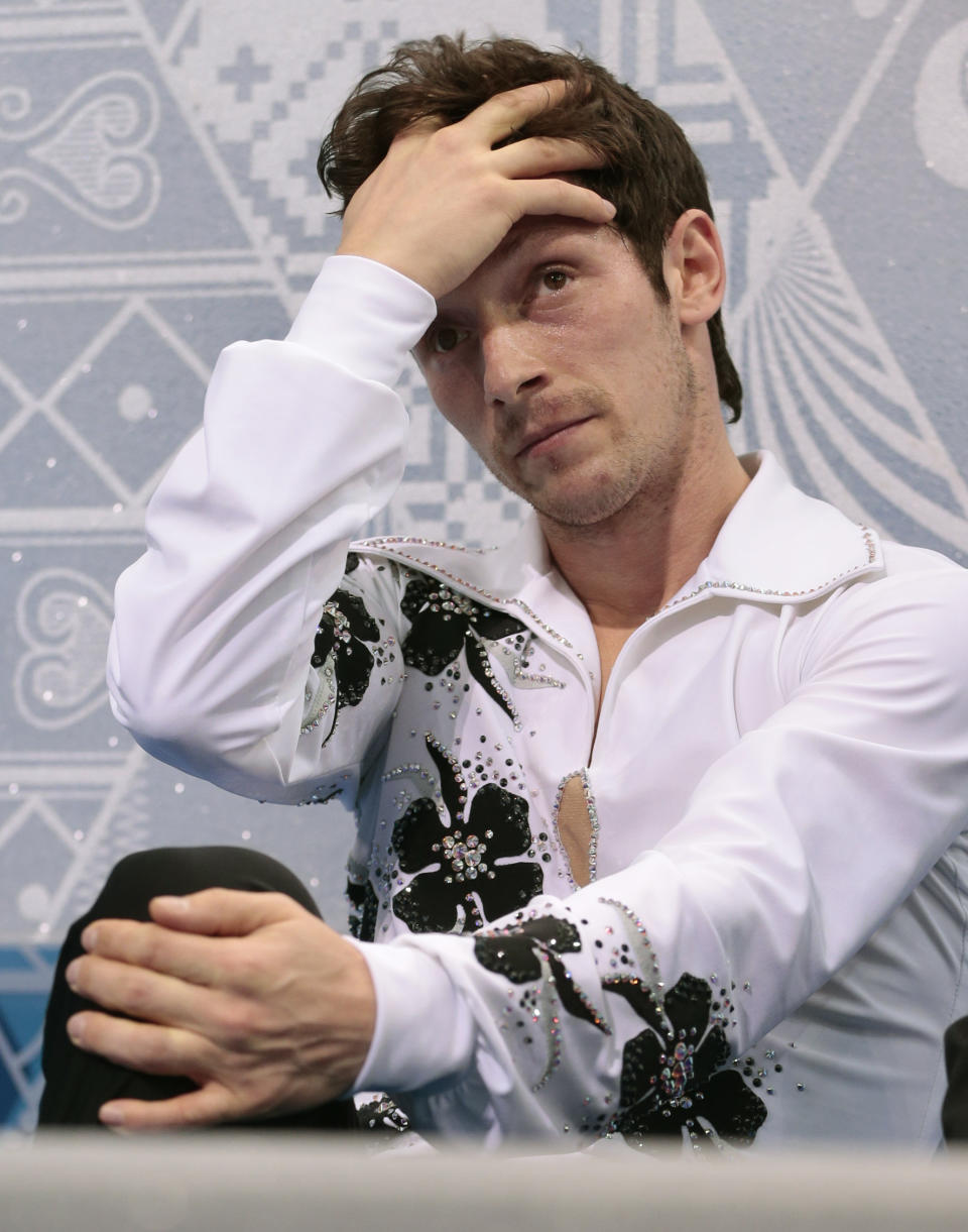 Zoltan Kelemen of Romania reacts after the men's short program figure skating competition at the Iceberg Skating Palace during the 2014 Winter Olympics, Thursday, Feb. 13, 2014, in Sochi, Russia. (AP Photo/Ivan Sekretarev)