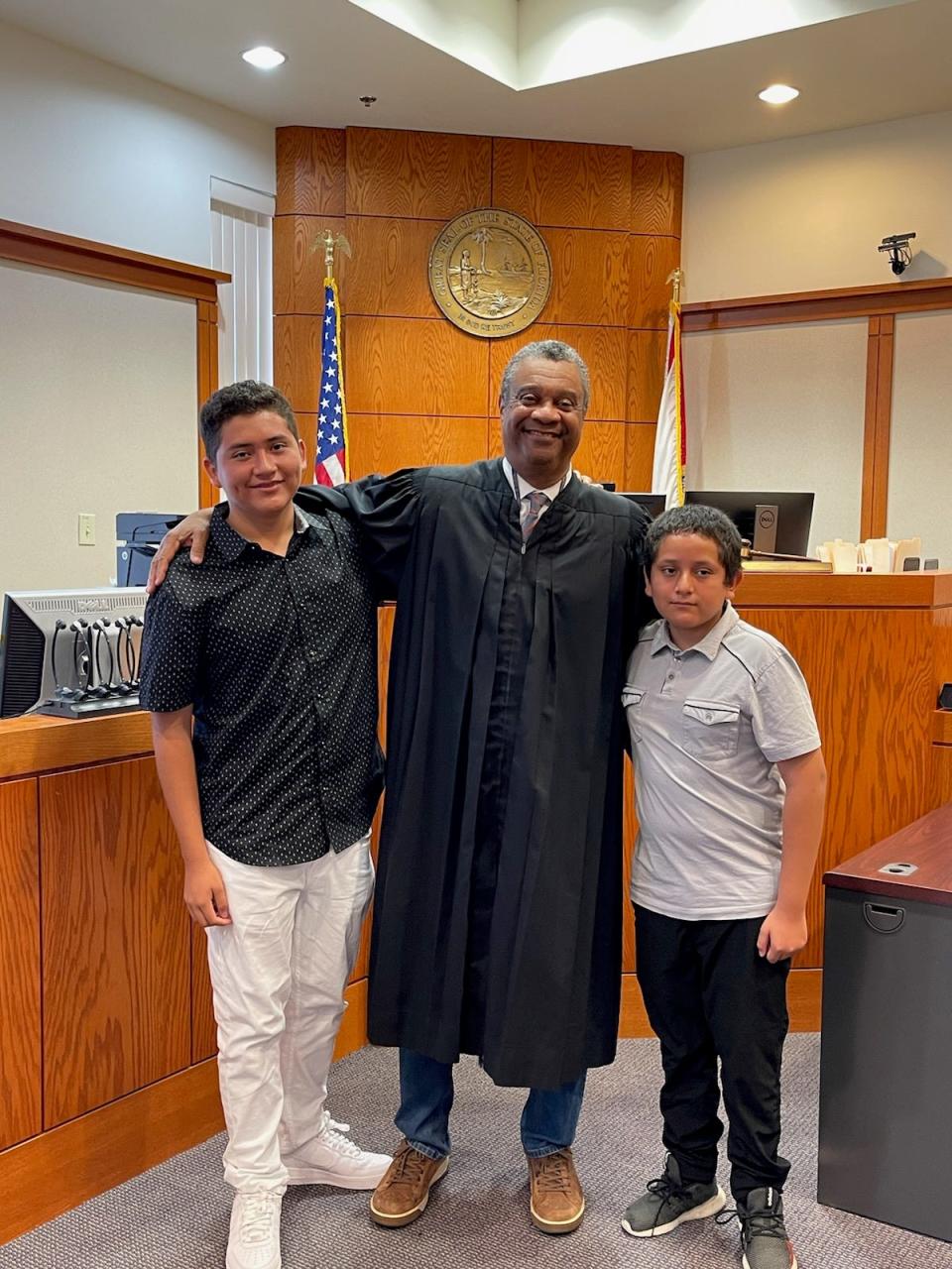 Mentees Diego and Alfonzo with Judge Charles Williams