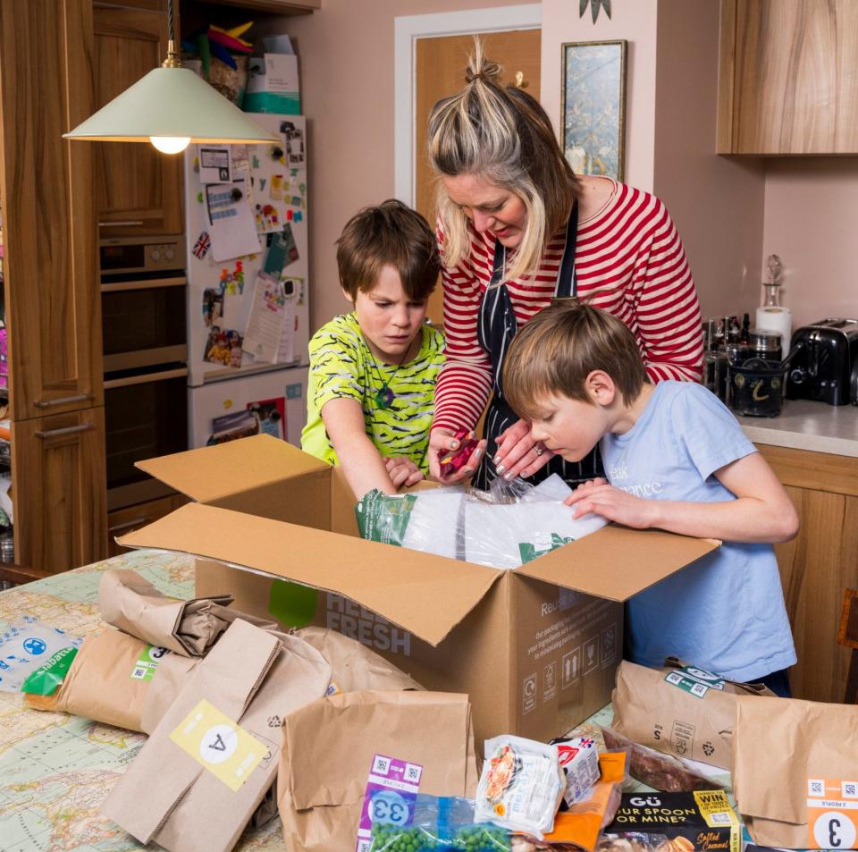 Lucy and her children unpacking their Hello Fresh delivery