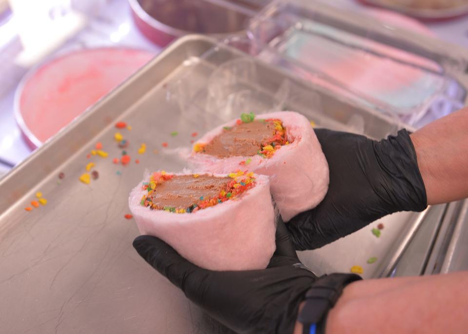 Kerneltime Gourmet Popcorn & Sweets is a specialty store with over 70 flavors of popcorn. Owner Jody Johnson makes a cotton candy burrito with ice cream, at the shop in Moore, Tuesday, March 8, 2022. 