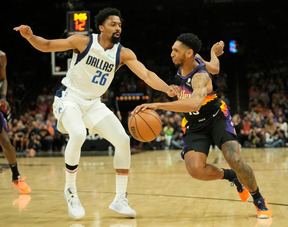 May 4, 2022; Phoenix, Ariz., U.S.; Phoenix Suns guard Cameron Payne (15) is defended by Dallas Mavericks guard Spencer Dinwiddie (26) during Game 2 of the Western Conference semifinals at Footprint Center.