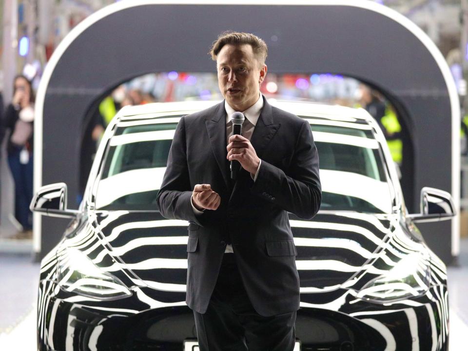 Elon Musk speaks during the official opening of the new Tesla electric car manufacturing plant on March 22, 2022 near Gruenheide, Germany