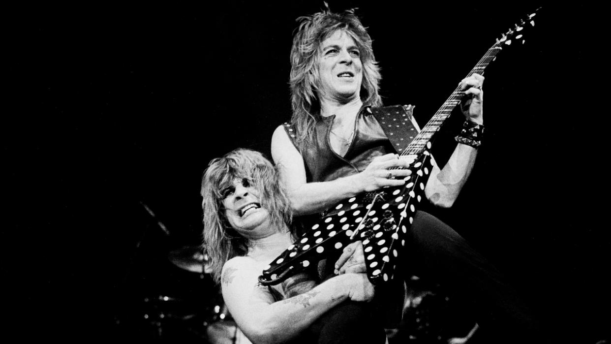  Ozzy Osbourne lifting Randy Rhoads on his shoulder onstage in 1982. 