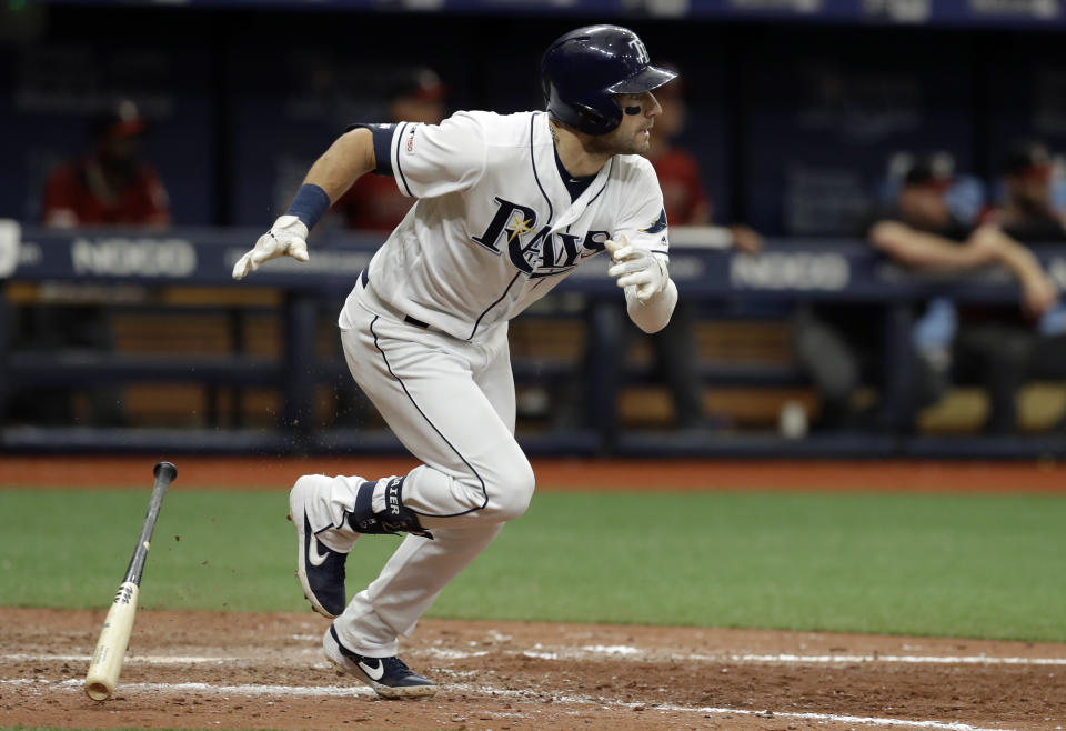 Tampa Bay Rays' Kevin Kiermaier runs to first base after hitting an RBI-single off Arizona Diamondbacks relief pitcher Greg Holland during the ninth inning of a baseball game, Wednesday, May 8, 2019, in St. Petersburg, Fla. Rays' Yandy Diaz scored. (AP Photo/Chris O'Meara)