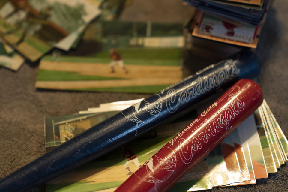 Johnson City Cardinals souvenirs, trading cards and photographs are seen at the home of TeriAnn Reynolds Thursday, April 27, 2023, in Johnson City, Tenn. TeriAnn Reynolds and her family were part of a little-known but vital piece of baseball's minor leagues for decades: host families. (AP Photo/George Walker IV)