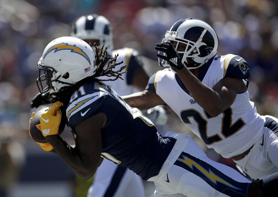 Los Angeles Chargers wide receiver Mike Williams, left, hauls in a touchdown catch in front of Los Angeles Rams cornerback Marcus Peters during the first half in an NFL football game Sunday, Sept. 23, 2018, in Los Angeles. (AP Photo/Jae C. Hong)