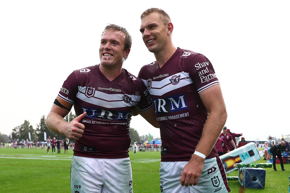 Seen here, Jake and Tom Trbojevic and Jake Trbojevic pose together after a victory against the Gold Coast Titans in the NRL. 