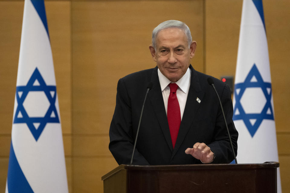 Israel's Prime Minister, Benjamin Netanyahu speaks at a meeting of his Likud party at Israel's parliament, the Knesset, for a vote on a contentious plan to overhaul the country's legal system, in Jerusalem, Monday, Feb. 20, 2023. (AP Photo/Maya Alleruzzo)