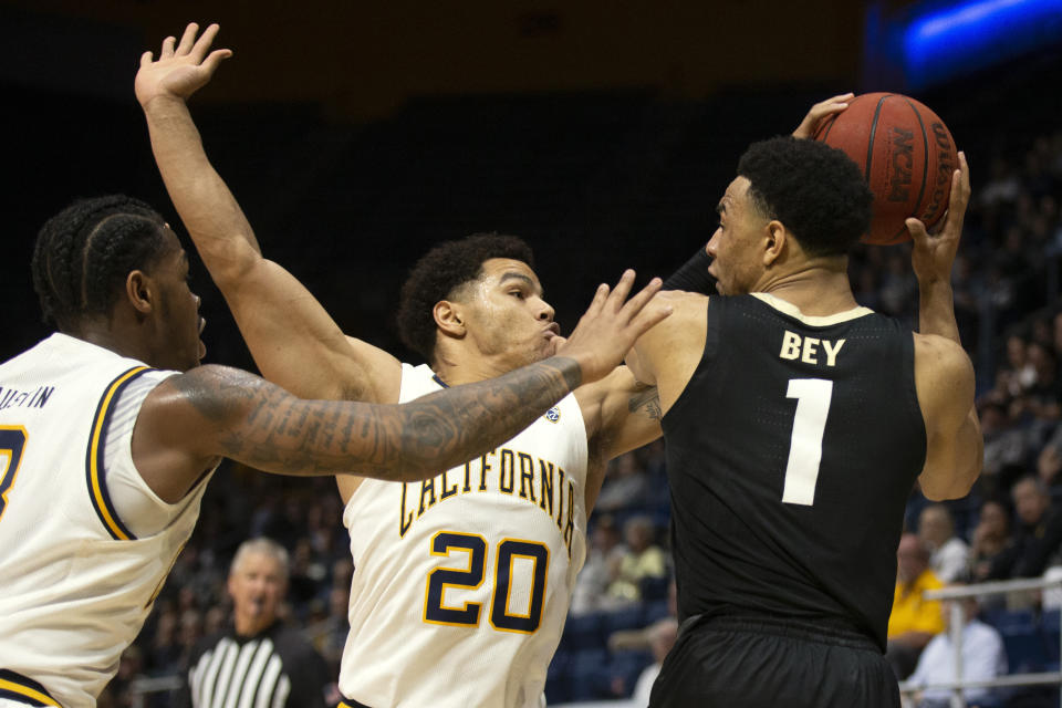 California guard Paris Austin (3) and California guard Matt Bradley (20) harass Colorado guard Tyler Bey (1) during the first half of an NCAA college basketball game Thursday, Feb. 27, 2020, in Berkeley, Calif. (AP Photo/D. Ross Cameron)