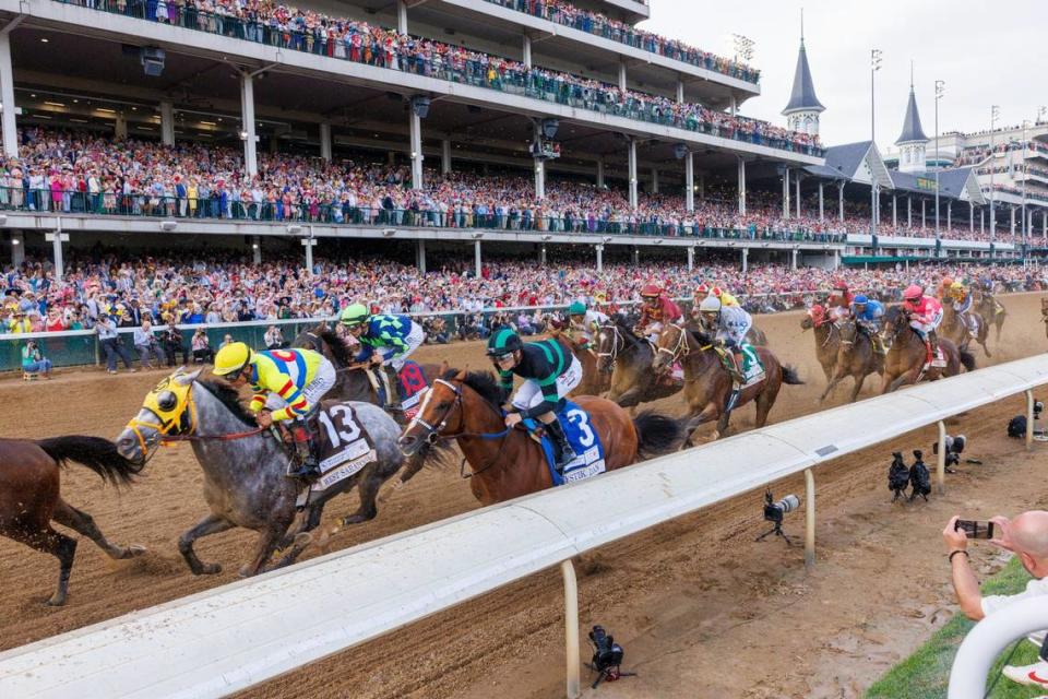 Eventual Kentucky Derby winner Mystik Dan (3) passes the finish line in the middle of the pack the first time by in Saturday’s race.