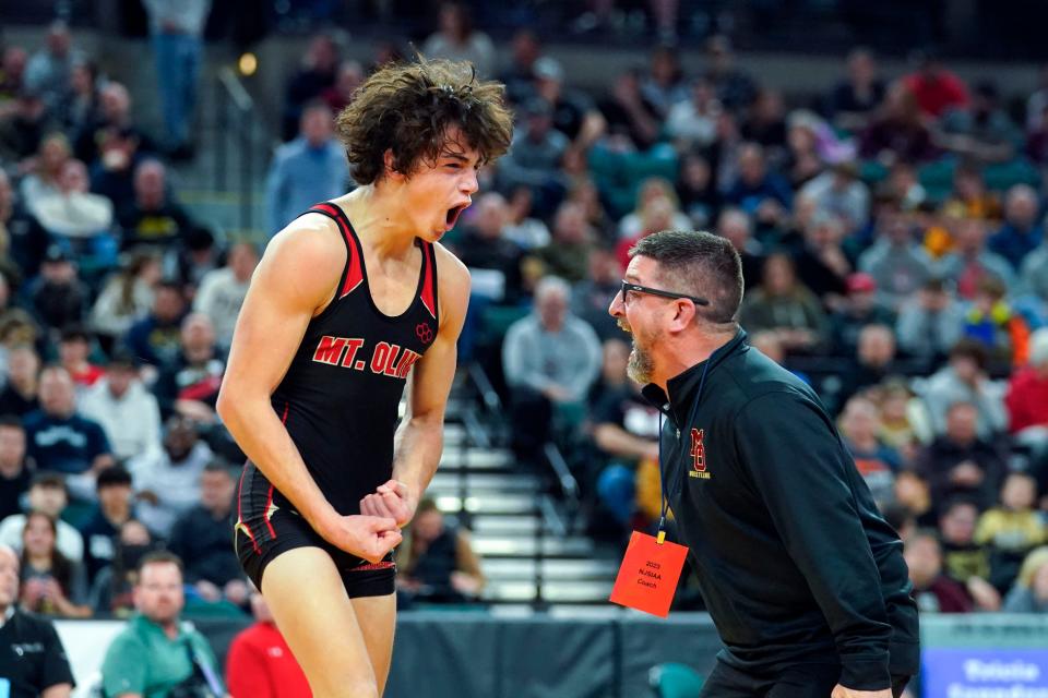 Jack Bastarrika of Mount Olive, left, celebrates with coach Bill Romano after winning his 132-pound semifinal bout on day two of the NJSIAA state wrestling tournament in Atlantic City on Friday, March 3, 2023.