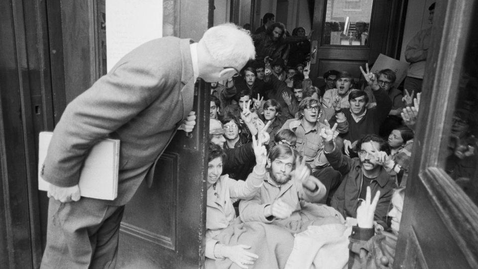 A professor finds an entrance blocked by a student sit-in, at one of four buildings taken over by demonstrations on Columbia University in April 1968. - Bettmann Archive/Getty Images