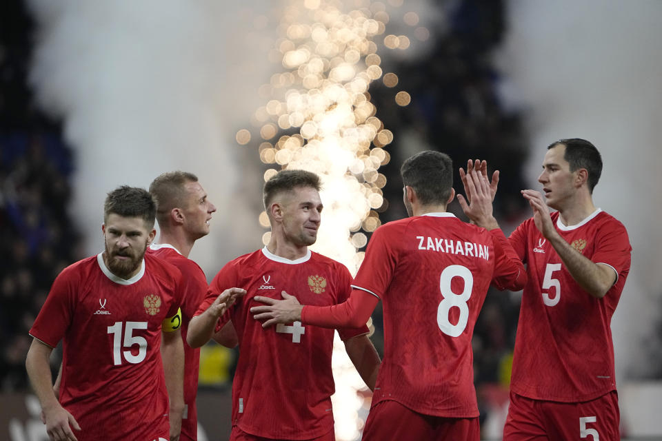 Russia players celebrate after Russia's Ivan Sergeyev scored his side's fourth goal during an international friendly soccer match between Russia and Serbia at the Central Dynamo Stadium of Lev Yashin in Moscow, Russia, Thursday, March 21, 2024. (AP Photo/Alexander Zemlianichenko)