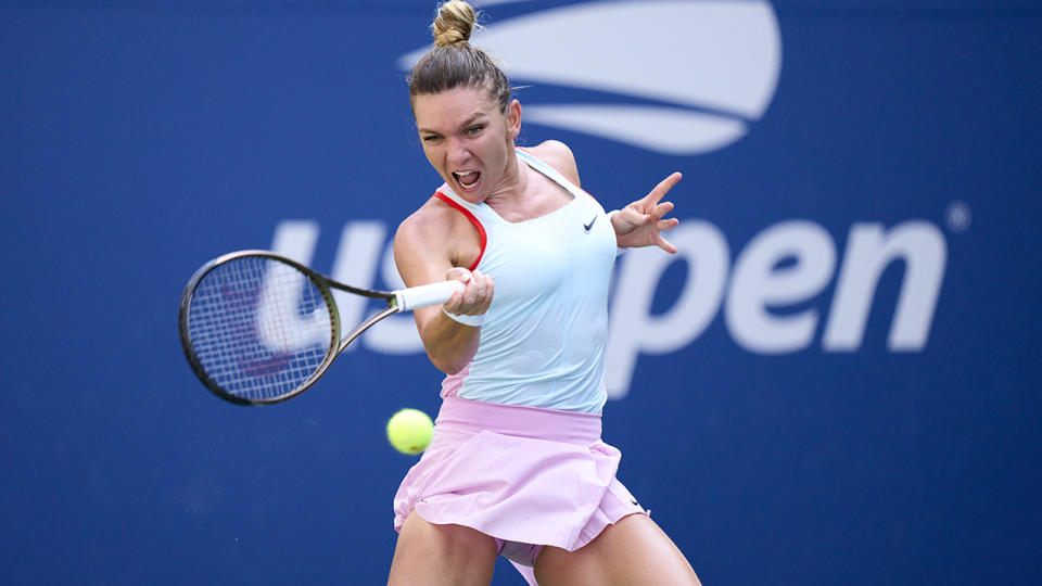 Simona Halep is pictured returning a shot at the 2022 US Open.