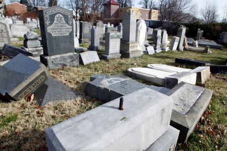 Headstones lay on the ground after vandals pushed them off their bases in the Mount Carmel Cemetery, a Jewish cemetery, in Philadelphia, Pennsylvania, U.S. February 27, 2017. REUTERS/Tom Mihalek