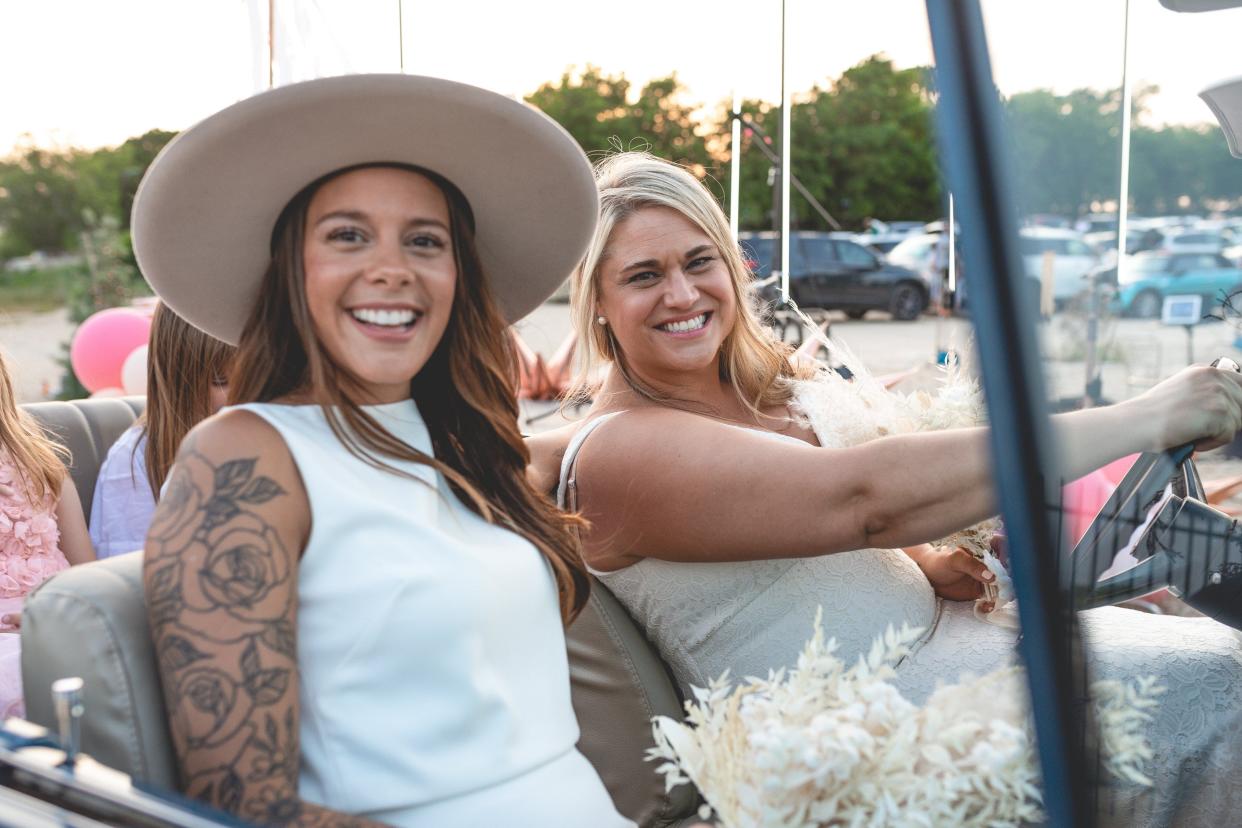 Bri Houk, left, and Lindsey Leaverton got married on April 28, 2020, at Doc's Drive In Theatre in Buda. Their original wedding plans were canceled due to the coronavirus pandemic, so they threw an alternate, socially distant ceremony together in 18 days. Austin author Jen Hatmaker served as the officiant.