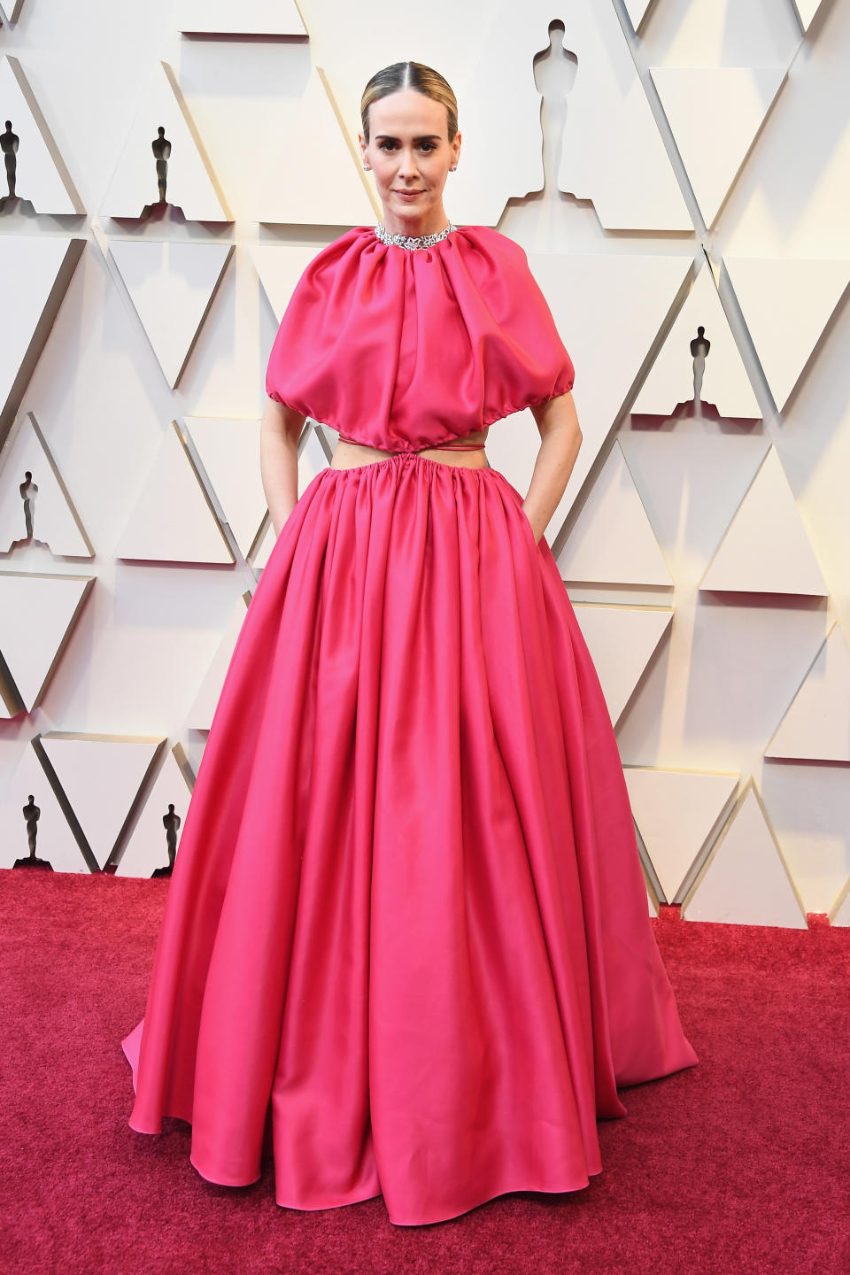 <p>Always a trendsetter, Paulson opted for a bright pink look by Brandon Maxwell that showed just a hint of skin. <em>[Photo: Getty]</em> </p>