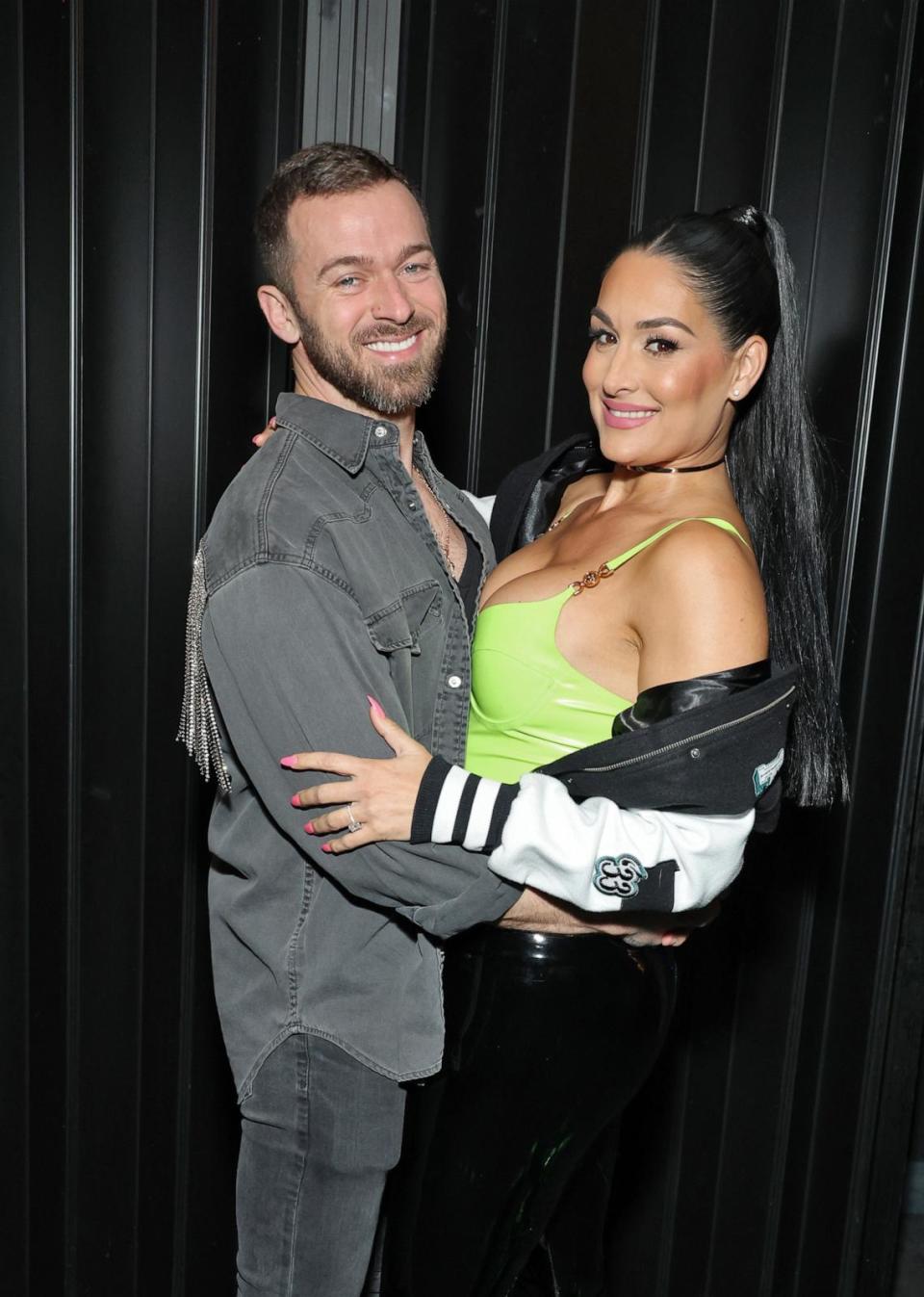 PHOTO: Artem Chigvintsev and Nikki Bella attend Brie and Nikki Bella's live edition of SiriusXM's The Bellas Podcast on February 08, 2023 in Phoenix, Arizona. (Cindy Ord/Getty Images for SiriusXM)