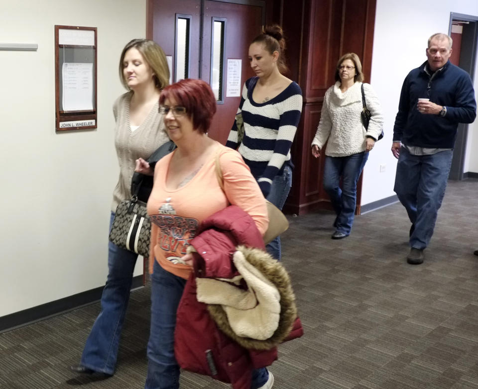 Family and victims arrive for a hearing for Aurora theater shooting suspect James Holmes at district court in Centennial, Colo., on Friday Jan. 31, 2014. Holmes has pleaded not guilty by reason of insanity to charges of killing 12 people and injuring 70 at a Denver-area movie theater in July 2012. Prosecutors are seeking the death penalty. (AP Photo/Ed Andrieski, Pool)