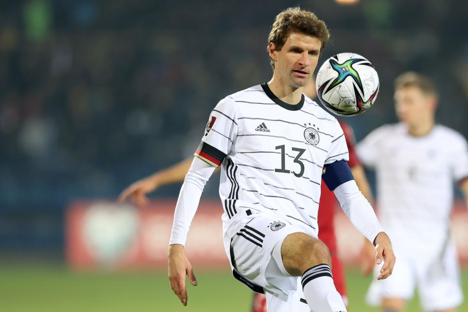 Thomas Muller dribbles a soccer ball