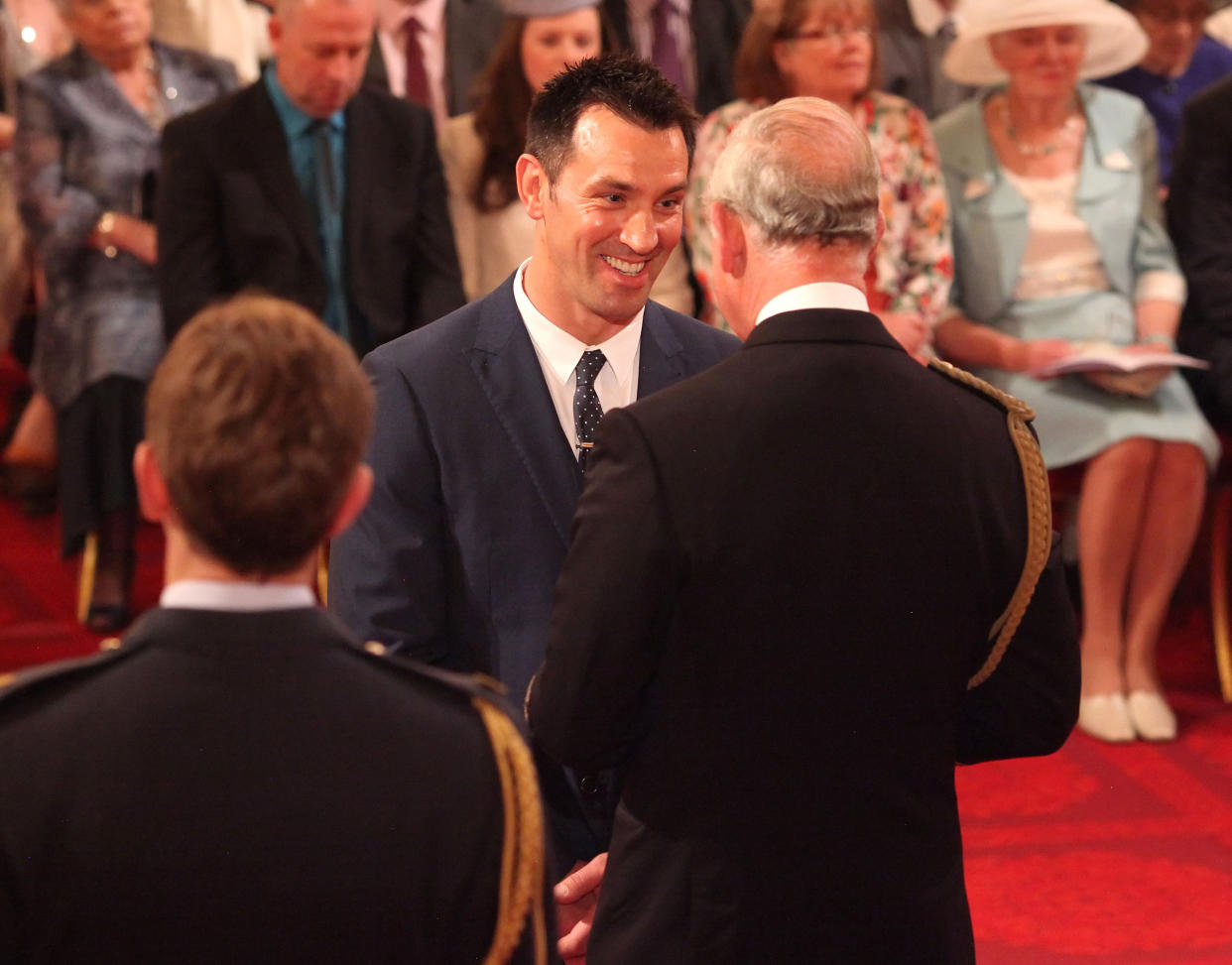 Paul Sculthorpe receiving his Member of the British Empire (MBE) medal from the Prince of Wales at an Investiture ceremony at Buckingham Palace, central London.