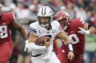 BYU quarterback Jaren Hall carries the ball during the second half of an NCAA college football game against Washington State, Saturday, Oct. 23, 2021, in Pullman, Wash. BYU won 21-19. (AP Photo/Young Kwak)