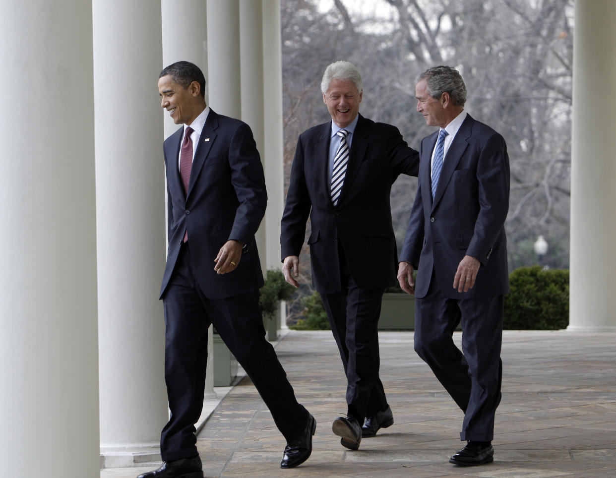 President Barack Obama walks with former Presidents Bill Clinton, cenrter, and George W. Bush, right, towards the Rose Garden at the White House in Washington Saturday, Jan. 16, 2010. Bush and Clinton have been asked by Obama to help with U.S. relief efforts after the earthquake in Haiti.  (AP Photo/Alex Brandon)