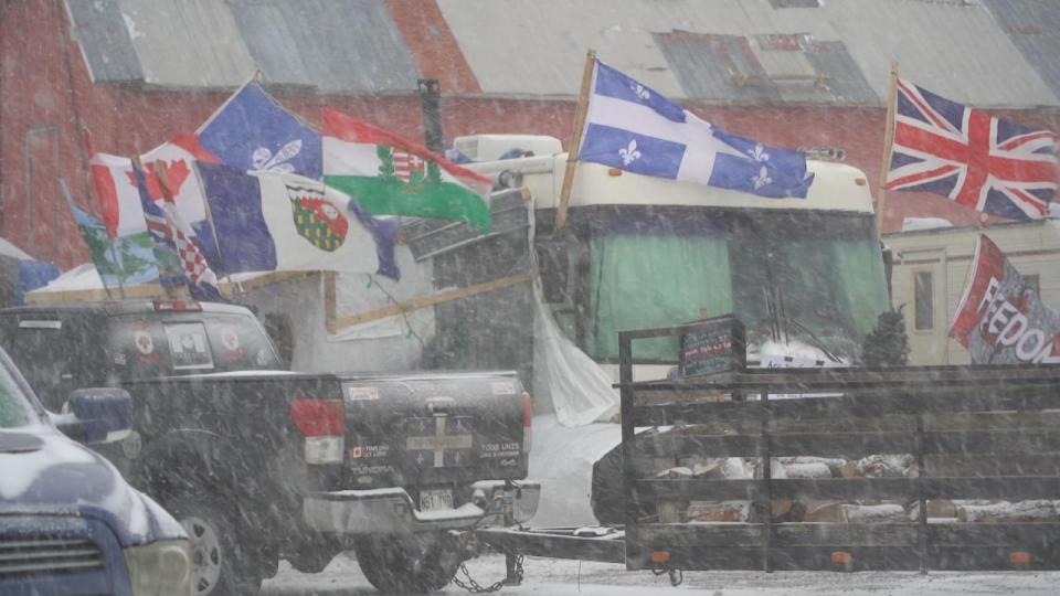 Vehicles and campers parked on land near La Nation.