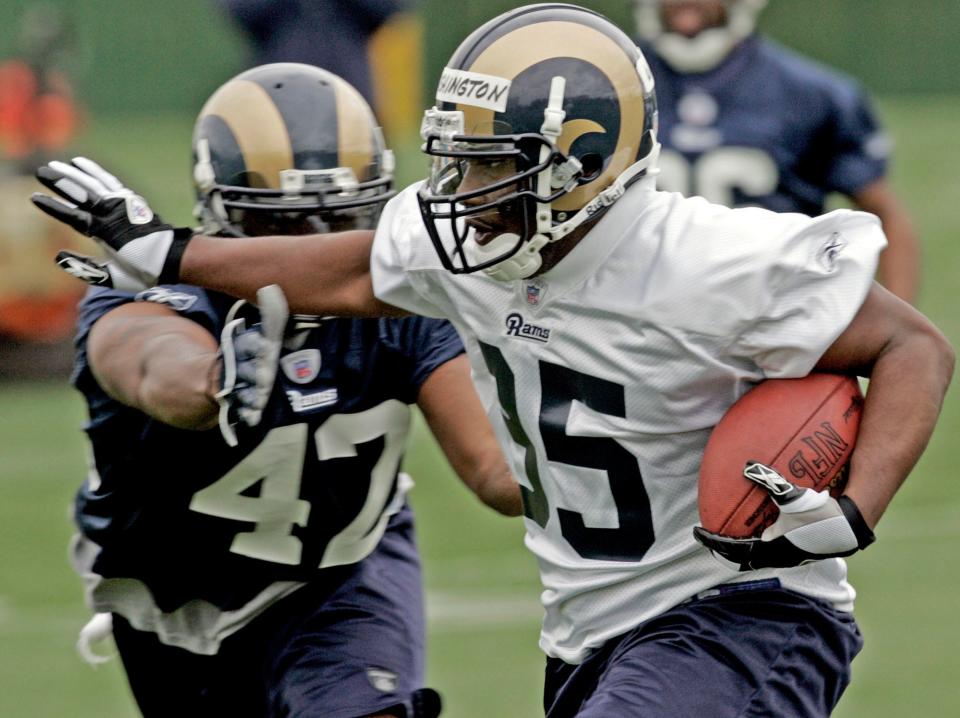 John David Washington (right), seen here at St. Louis Rams training camp in 2006, was a pro football running back before an Achilles injury shifted his focus to acting.