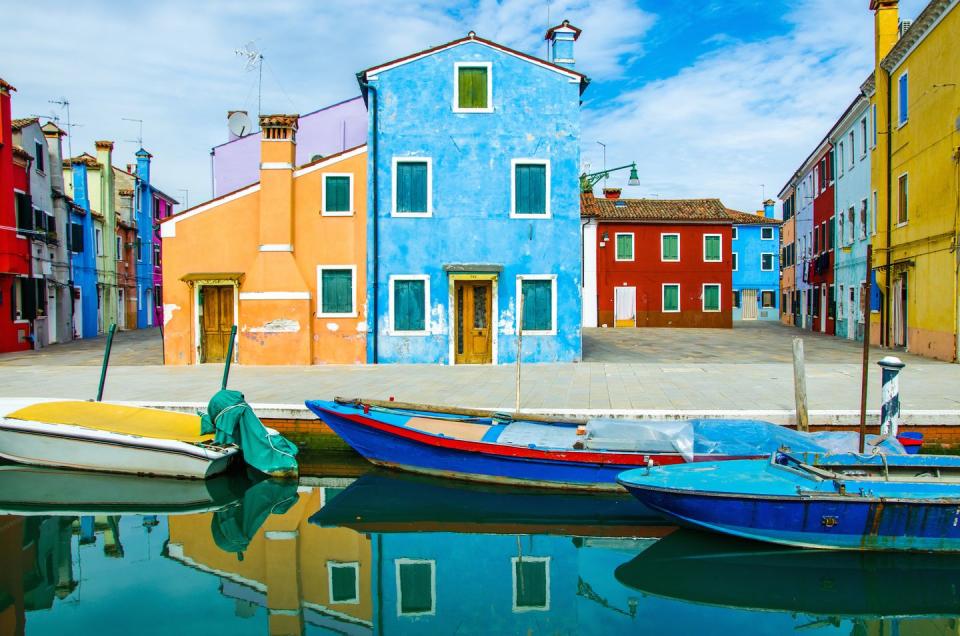 <p>There’s no shortage of color by the Burano canals. </p>