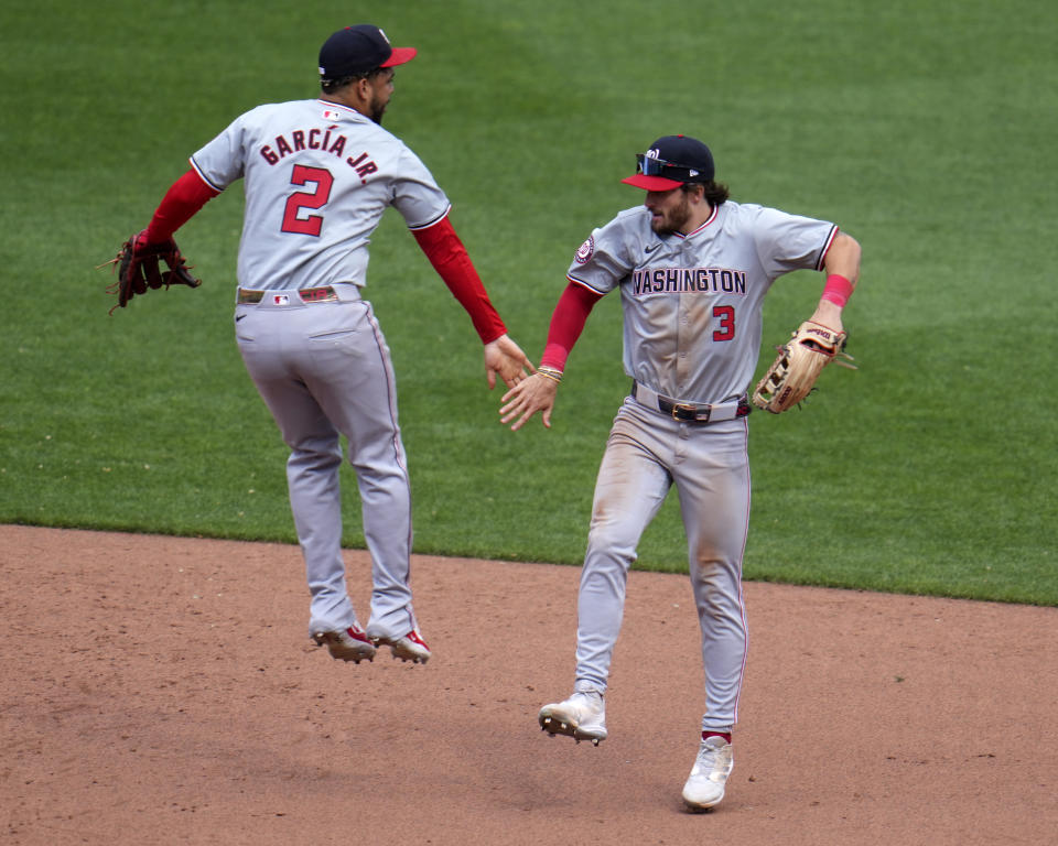 Washington Nationals' Dylan Crews (3) celebrates with Luis García Jr. after getting the final out of the first baseball game of a split doubleheader against the Pittsburgh Pirates in Pittsburgh, Saturday, Sept. 7, 2024. (AP Photo/Gene J. Puskar)