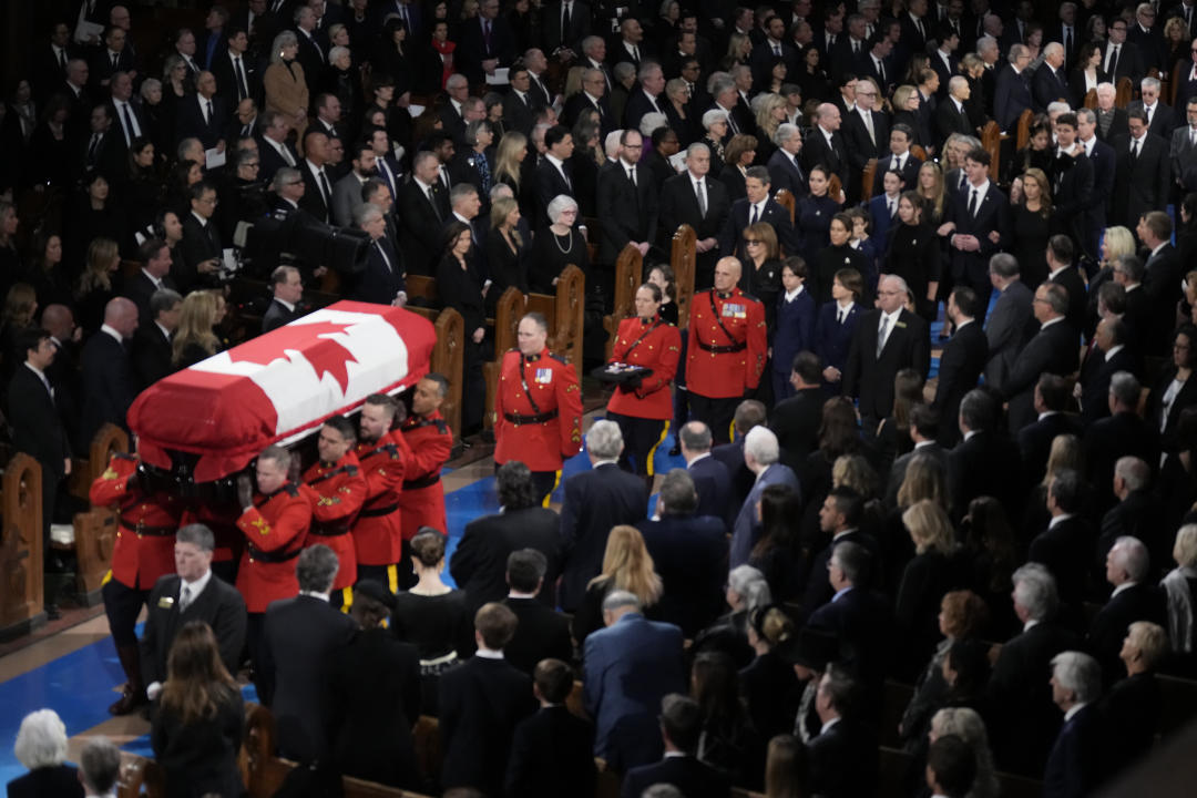 Family members follow as RCMP pallbearers carry the casket funeral of former prime minister Brian Mulroney at the Notre-Dame Basilica in Montreal, Saturday, March 23, 2024. THE CANADIAN PRESS/Adrian Wyld