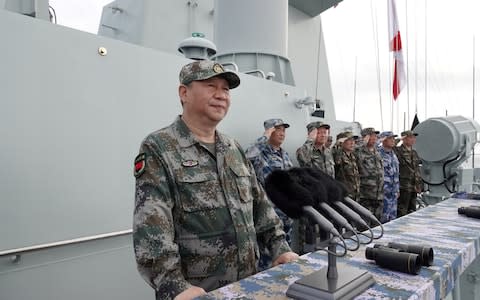Chinese President Xi Jinping delivers a speech as he reviews a military display of Chinese People's Liberation Army (PLA) Navy in the South China Sea last week - Credit: Xinhua/Reuters