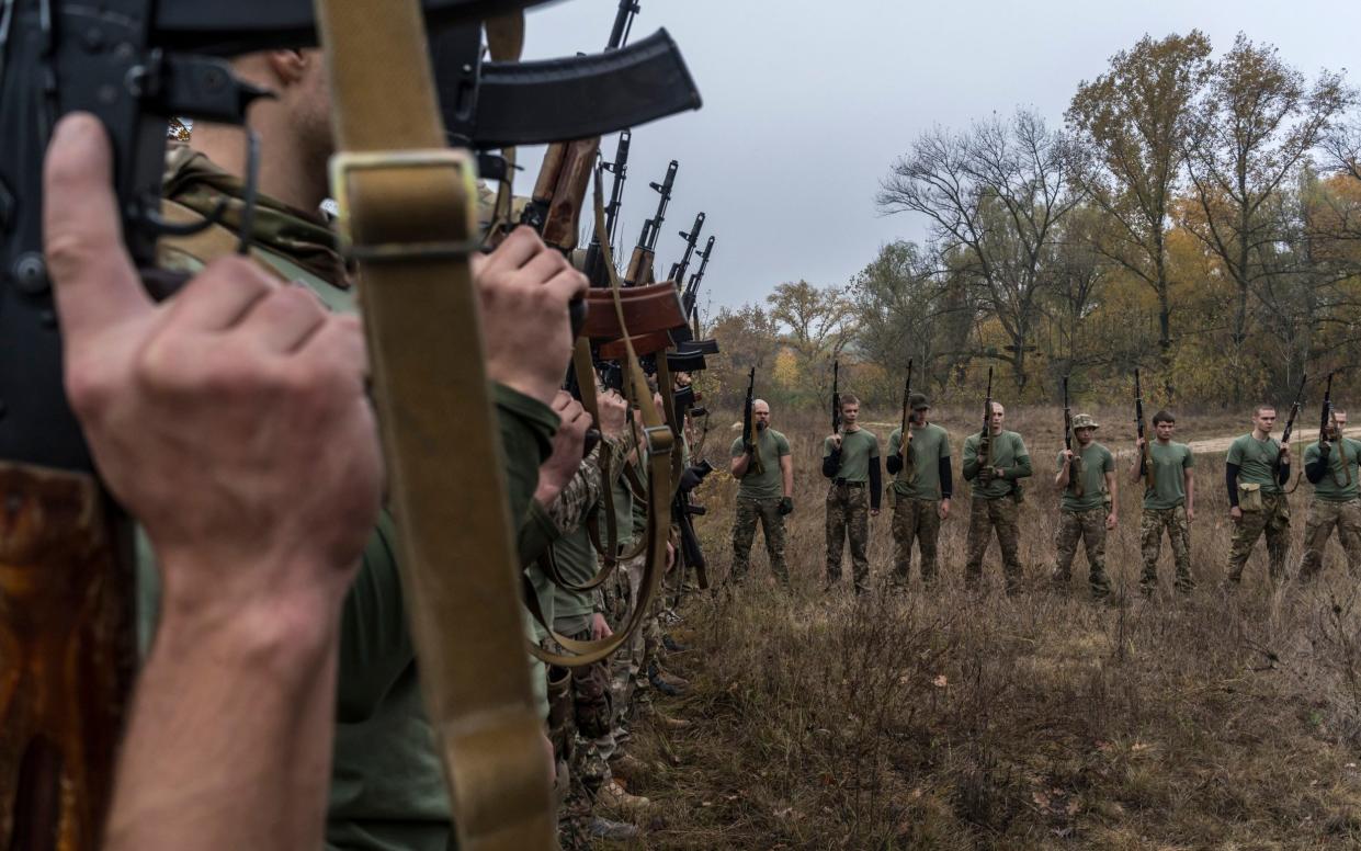 New recruits with the Ukrainian Army's Third Separate Assault Brigade participate in training in Kyiv