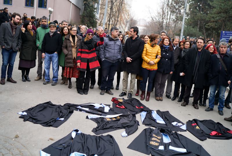 FILE PHOTO: Academics lay down their gowns during a protest against the dismissal of academics from universities following a post-coup emergency decree, in the Cebeci campus of Ankara University in Ankara