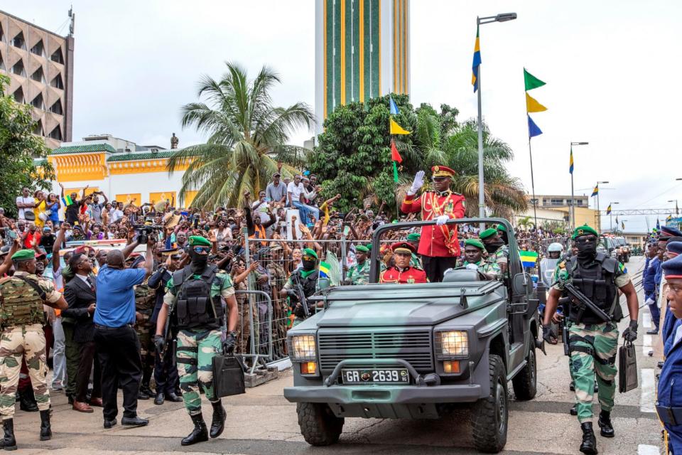 PHOTO: General Brice Clotaire Oligui Nguema greets the people of Gabon who came to cheer him after his inauguration as President of the Transition in Gabon, on Aug. 4, 2023 at the Presidential Palace in Libreville. (Desirey Minkoh/Afrikimages Agency/Universal Images Group via Getty Images)