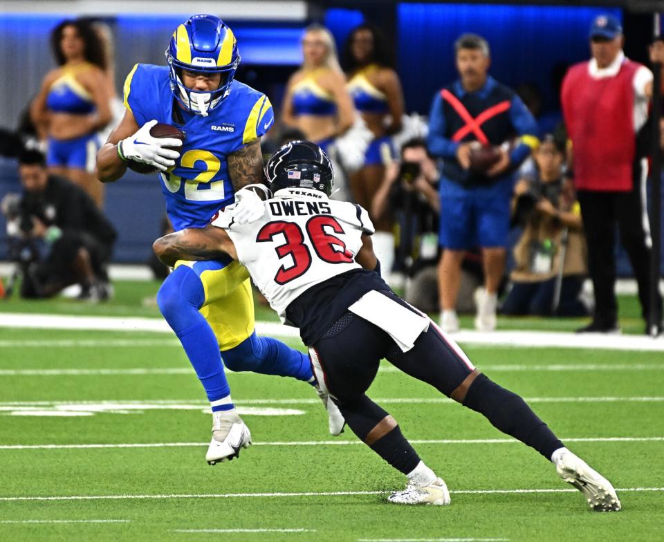 Rams receiver Lance McCutcheon makes a catch in front of Texans defensive back Jonathan Owens for a first down Aug. 18, 2022.