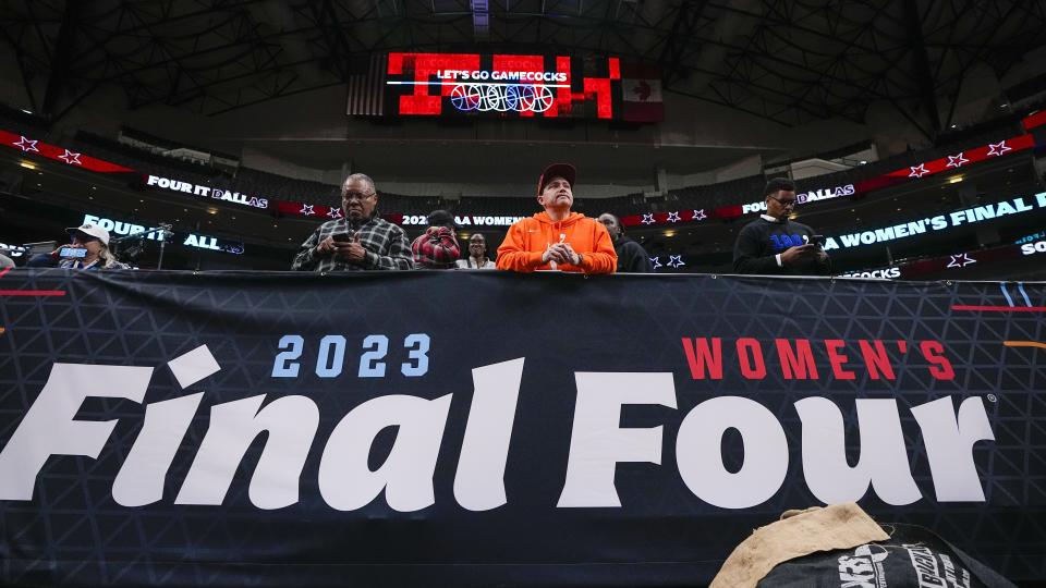 Fans watch a practice session for an NCAA Women's Final Four semifinals basketball game Thursday, March 30, 2023, in Dallas. (AP Photo/Tony Gutierrez)
