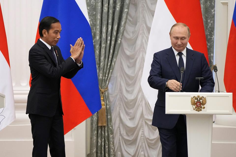 FILE - Indonesian President Joko Widodo, left, gestures after a joint news conference with Russian President Vladimir Putin after their meeting in the Kremlin in Moscow, Russia, Thursday, June 30, 2022. Indonesian President Joko Widodo, whose country holds the rotating presidency of the Group of 20 leading rich and developing nations, is heading to Ukraine and Russia for meetings with the leaders of the two warring nations following a visit to Germany to attend the Group of Seven summit. (AP Photo/Alexander Zemlianichenko, Pool, File)