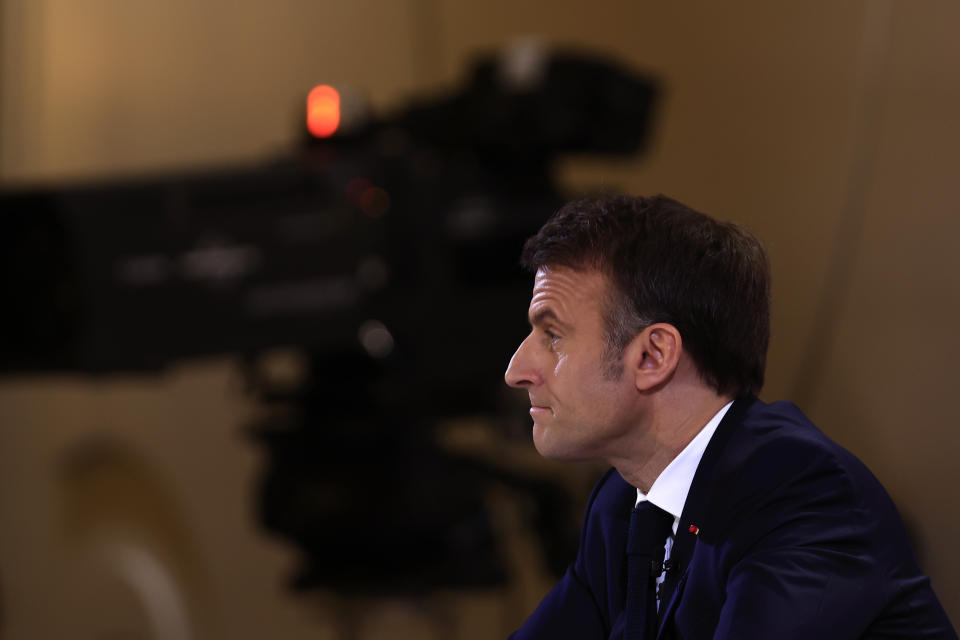French President Emmanuel Macron listens to a question during his first prime-time news conference to announce his top priorities for the year as he seeks to revitalize his presidency, vowing to focus on "results" despite not having a majority in parliament, Tuesday, Jan. 16, 2024 at the Elysee Palace in Paris. (AP Photo/Aurelien Morissard)