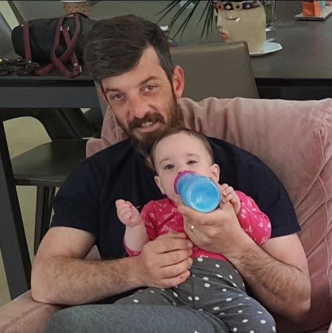 David Cunio, holding one of his twin daughters. David and his wife Sharon have been held by Hamas for 25 days.