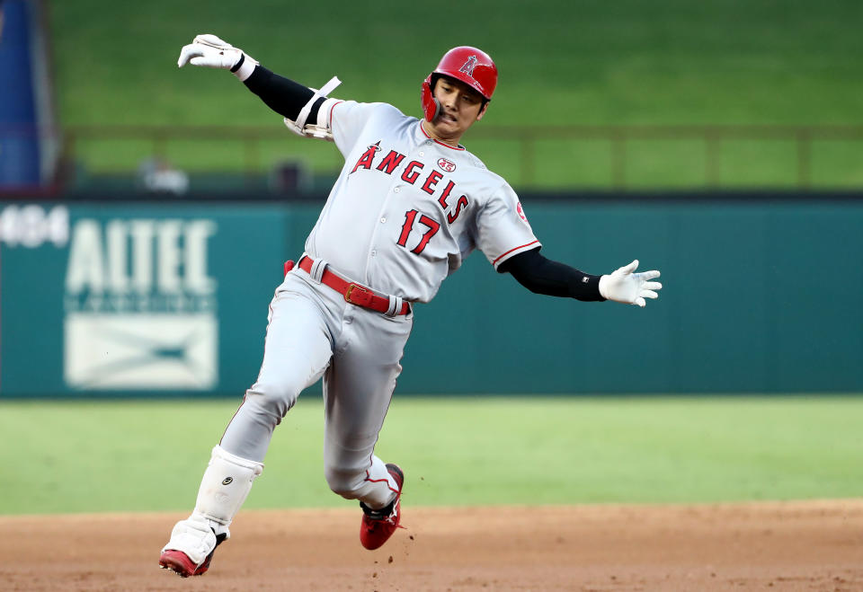 ARLINGTON, TEXAS - AUGUST 19:  Shohei Ohtani #17 of the Los Angeles Angels hits a triple against the Texas Rangers at Globe Life Park in Arlington on August 19, 2019 in Arlington, Texas. (Photo by Ronald Martinez/Getty Images)