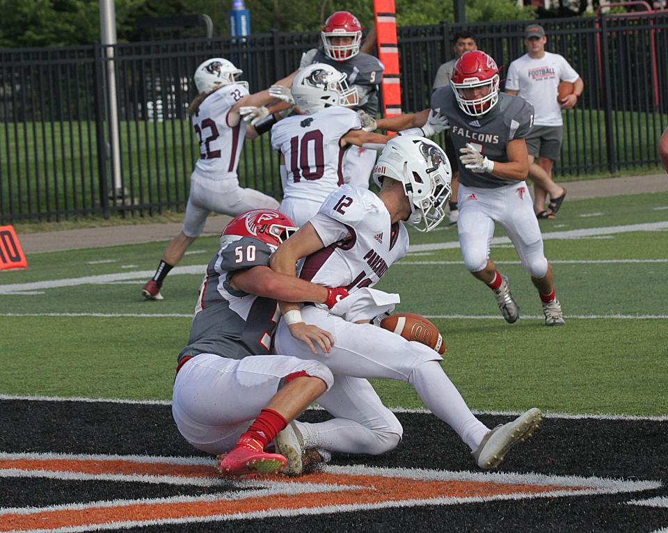 Parchment QB Aaron Jasiak is sacked for a safety by Constantine's Cohen McGee on Friday.