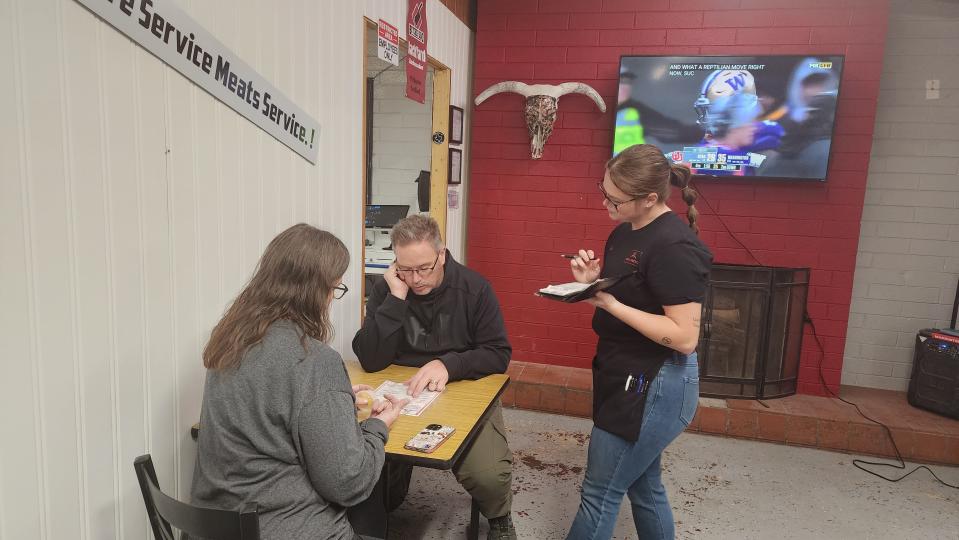 An employee greets customers at the newly opened Nine Line BBQ on Hillside Road in Amarillo.